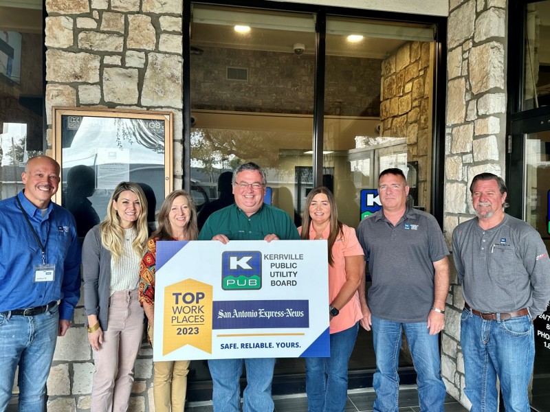 Members of KPUB’s leadership team are pictured together for the utility company’s 2023 Top Workplaces Award announcement.